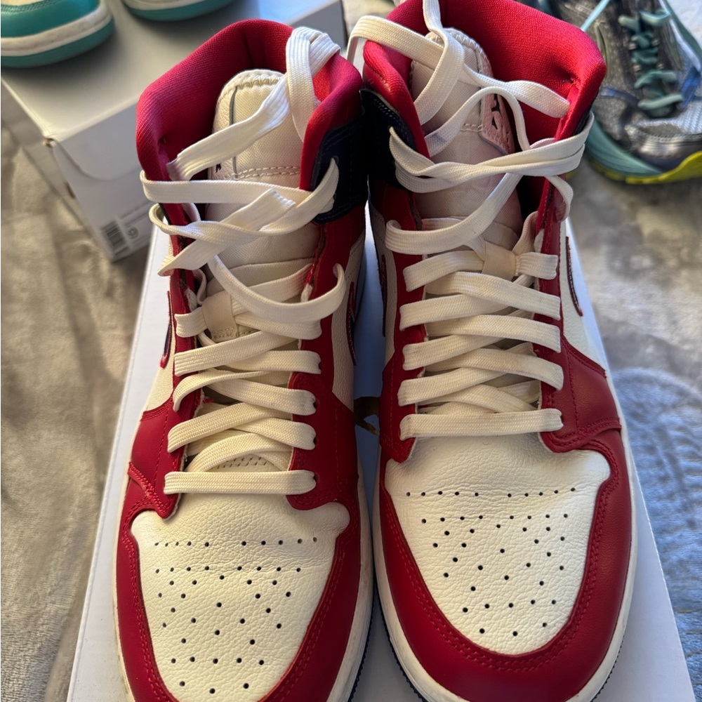 Women’s red white & navy blue high top Jordan’s